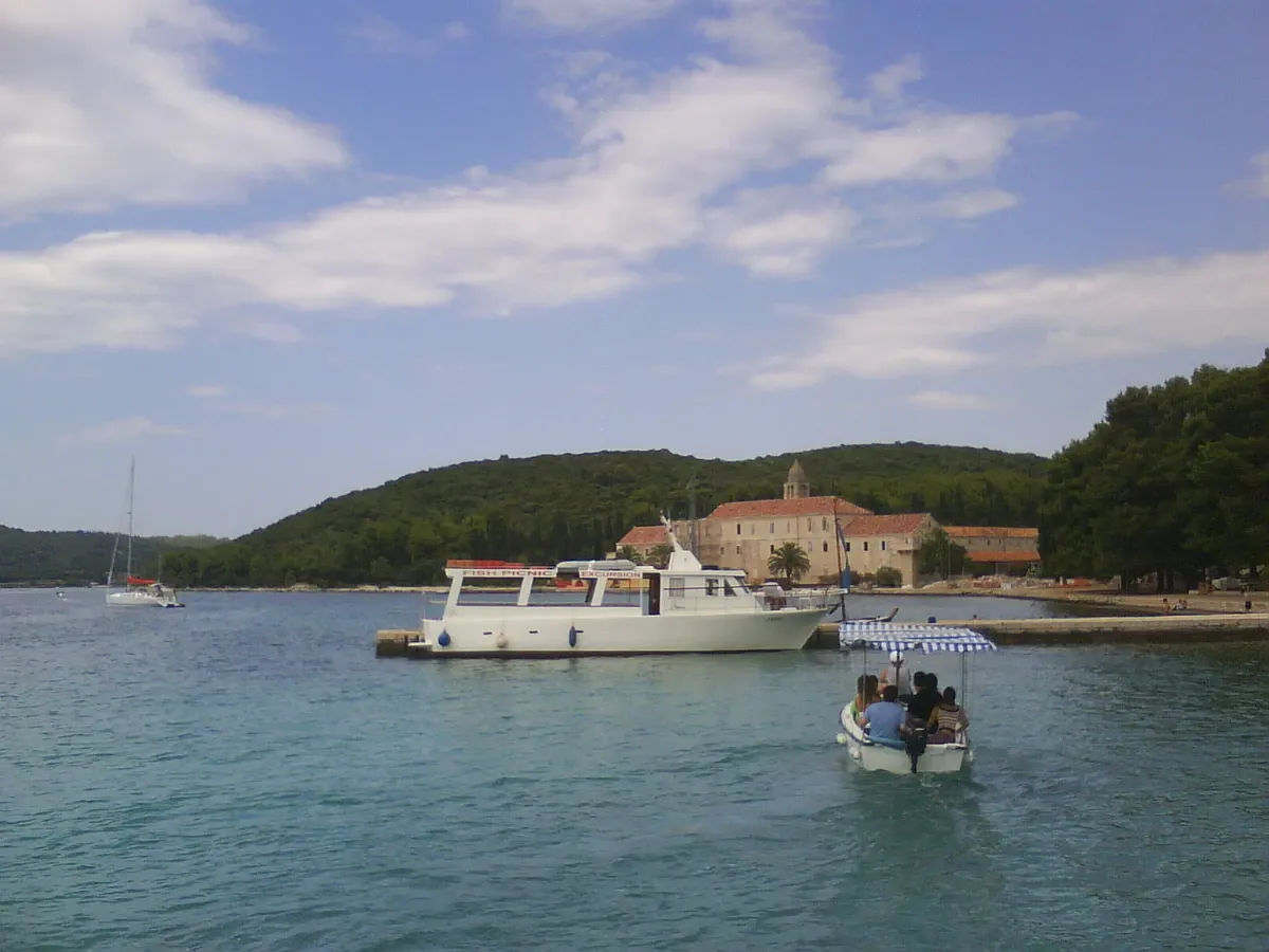 Franciscan monastery on Badija island seen across the water from an approaching boat near Korcula in Croatia